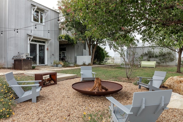 view of yard featuring a fire pit