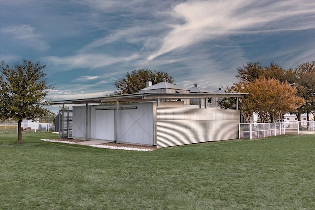 view of outbuilding with a yard