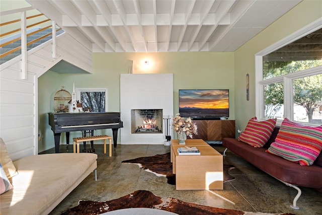 living room featuring beamed ceiling