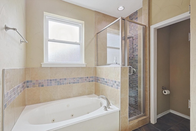 bathroom featuring a healthy amount of sunlight, tile patterned flooring, and independent shower and bath