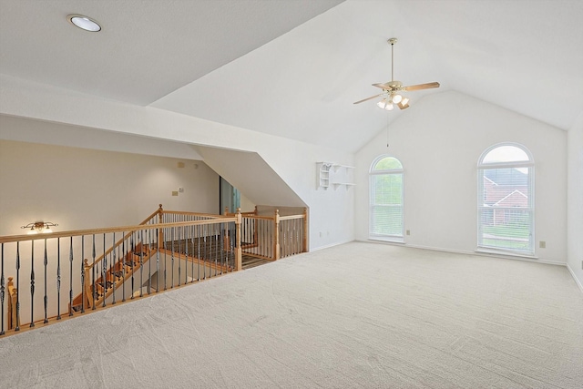 additional living space with carpet flooring and lofted ceiling