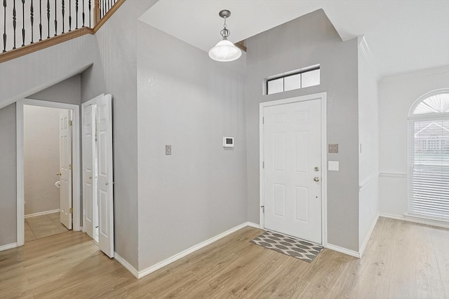 entryway with light hardwood / wood-style floors