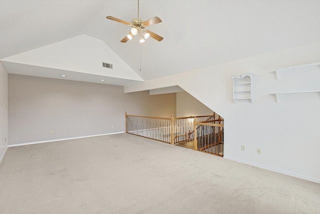 unfurnished living room featuring ceiling fan, high vaulted ceiling, and carpet flooring