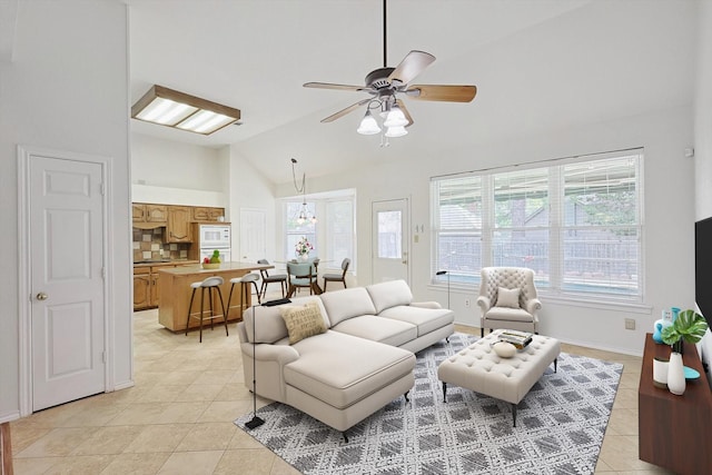 tiled living room with ceiling fan and lofted ceiling