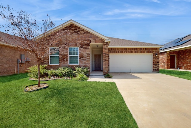 ranch-style house featuring a garage and a front yard