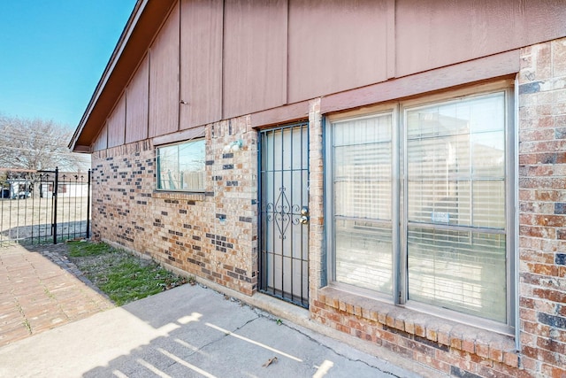 view of exterior entry featuring a patio