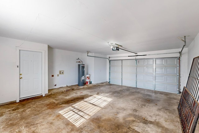 garage featuring water heater and a garage door opener