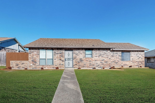 ranch-style house with a front lawn