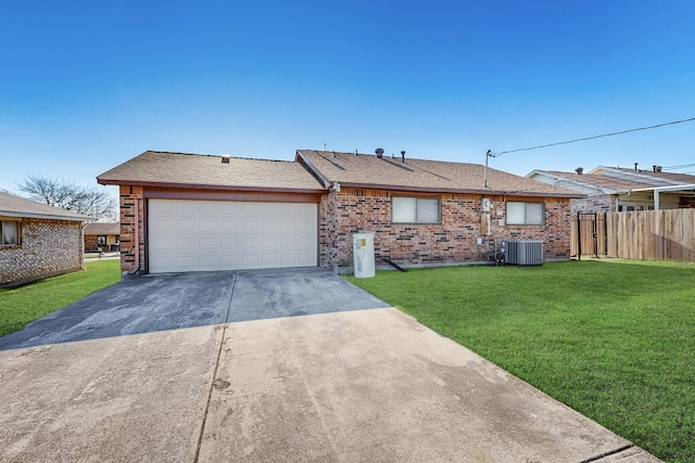 ranch-style home featuring central AC unit, a garage, and a front lawn