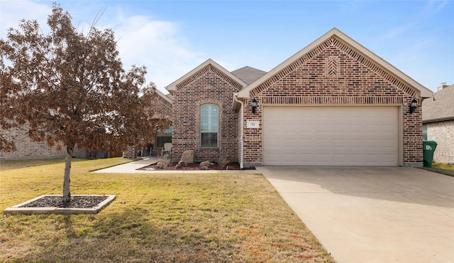 view of property featuring a garage and a front lawn