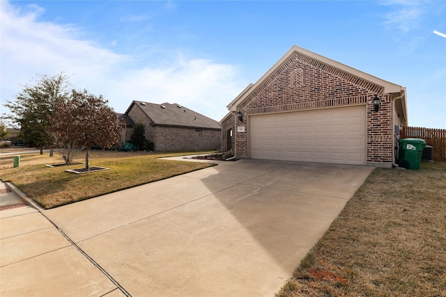 view of side of home with a garage and a yard