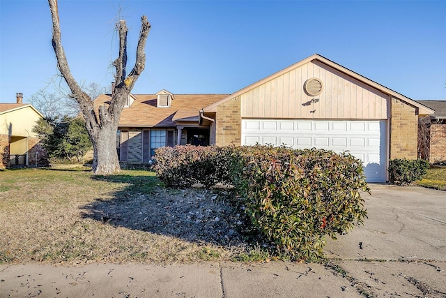 ranch-style home with a garage and a front yard