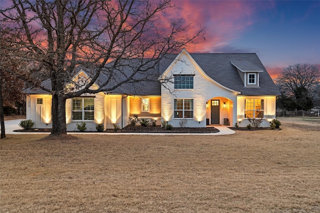 view of front of house with a yard