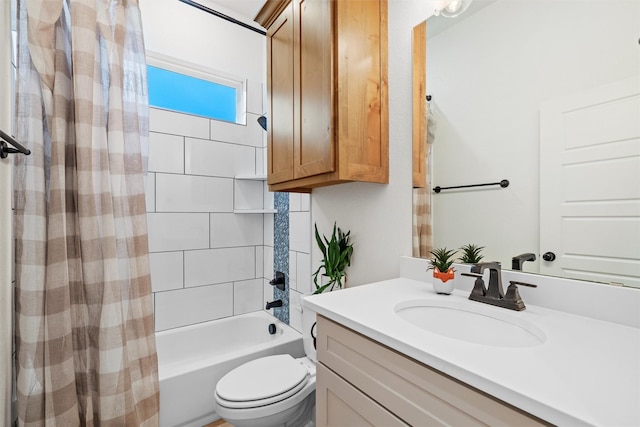 full bathroom featuring vanity, toilet, and shower / bath combination with curtain