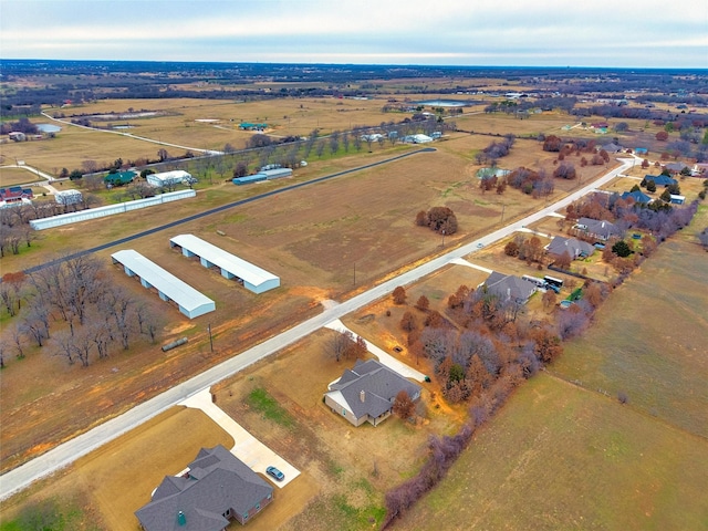 birds eye view of property featuring a rural view