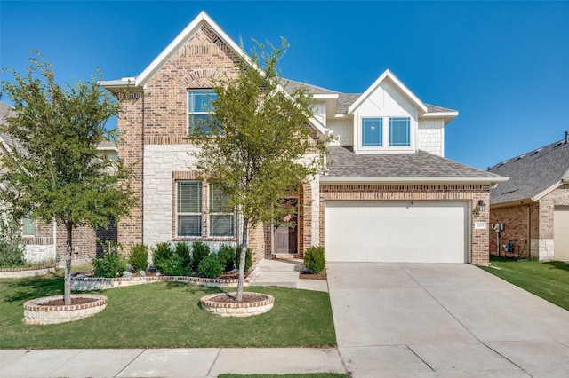 view of front of house featuring a garage and a front lawn