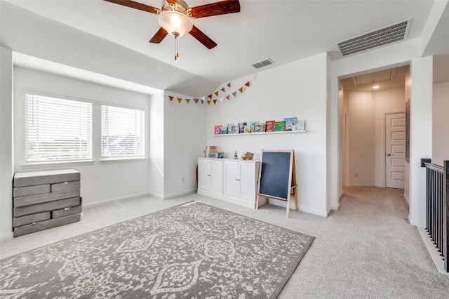 bedroom featuring ceiling fan, light carpet, and lofted ceiling