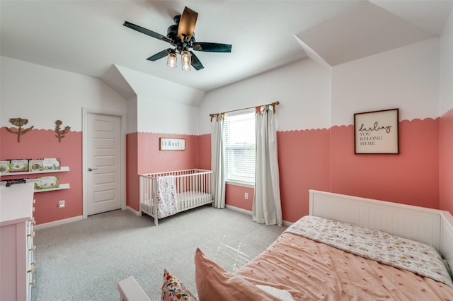 bedroom with lofted ceiling, light colored carpet, and ceiling fan