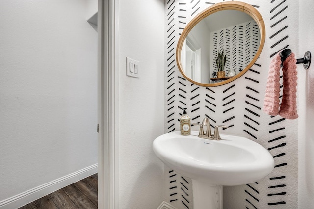 bathroom with sink and hardwood / wood-style floors