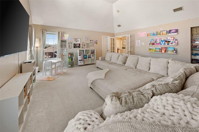 carpeted living room featuring built in features and lofted ceiling