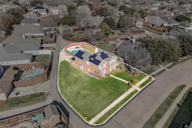 rear view of house with a patio area, a yard, solar panels, and a swimming pool with hot tub