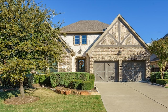 view of front facade with a garage and a front lawn