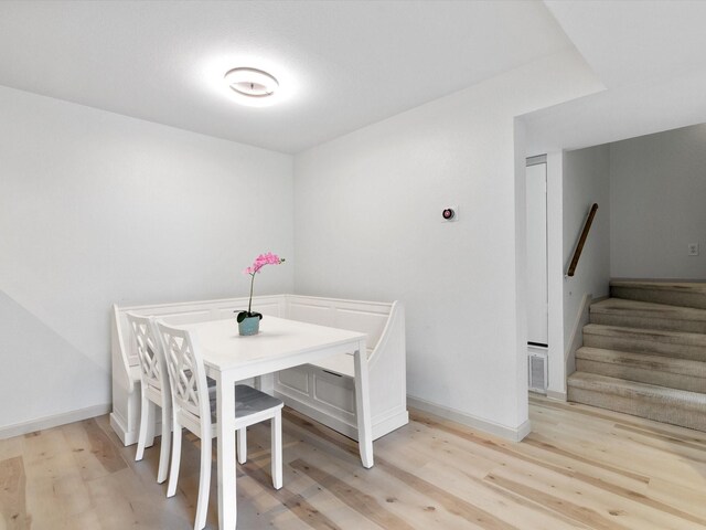 dining room with light hardwood / wood-style flooring