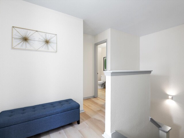 hall with light hardwood / wood-style floors