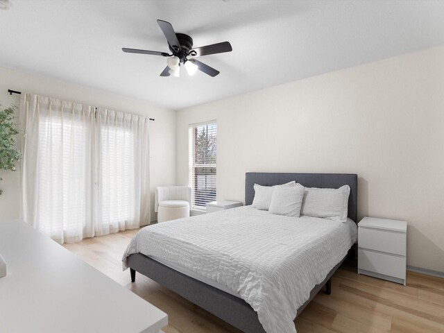 bedroom featuring ceiling fan and light hardwood / wood-style flooring