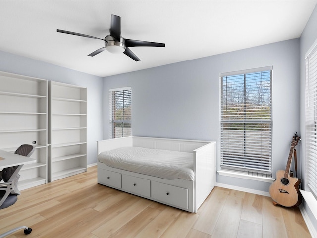 bedroom featuring ceiling fan and light hardwood / wood-style floors