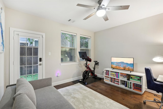 interior space featuring ceiling fan and dark hardwood / wood-style floors