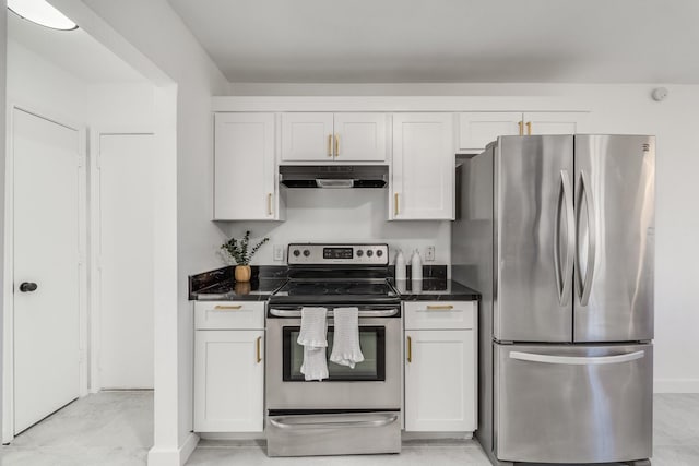 kitchen featuring white cabinets, dark stone counters, and appliances with stainless steel finishes