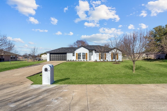 ranch-style house with a garage and a front yard