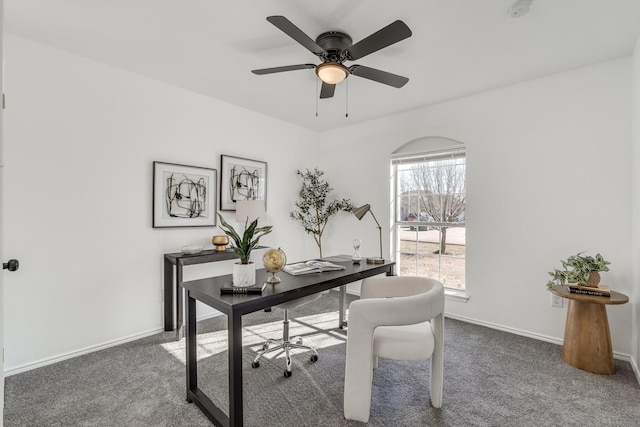 office featuring ceiling fan and dark colored carpet