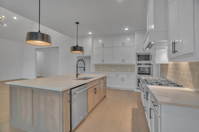 kitchen featuring stainless steel appliances, white cabinetry, hanging light fixtures, and a large island