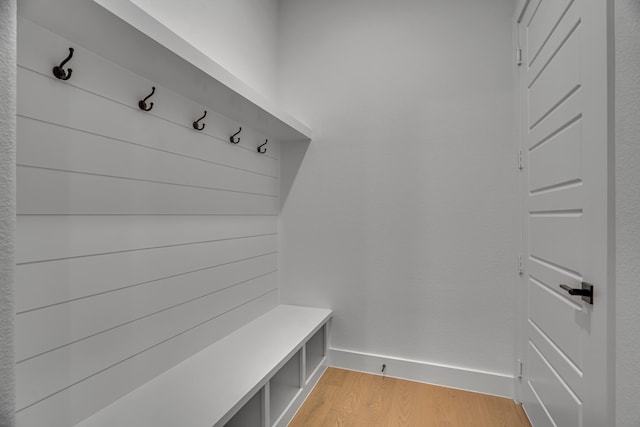 mudroom with light hardwood / wood-style floors