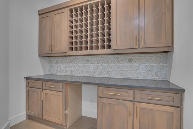 kitchen with decorative backsplash and light hardwood / wood-style flooring