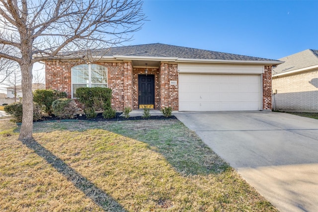 single story home featuring a garage and a front lawn