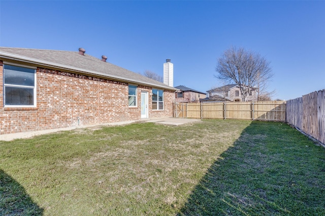 view of yard with a fenced backyard