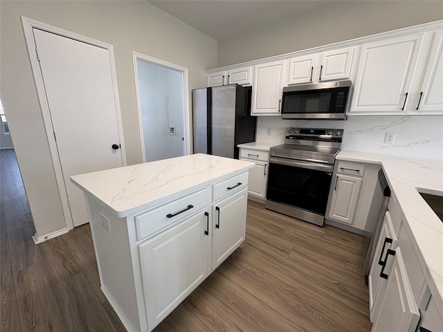 kitchen featuring appliances with stainless steel finishes, dark wood-style flooring, and white cabinetry