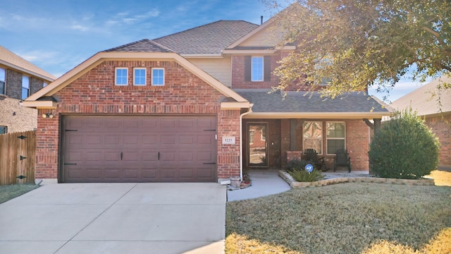 view of front of house featuring a front yard and a garage