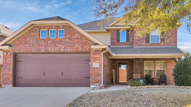 front facade with a garage and covered porch