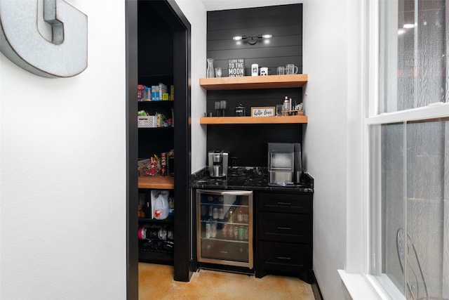 storage area featuring wine cooler