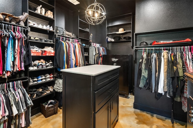 walk in closet featuring a chandelier