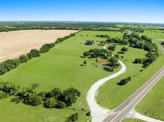 birds eye view of property with a rural view