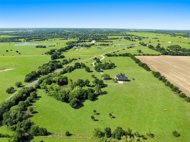 birds eye view of property with a water view and a rural view