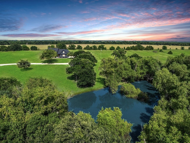 aerial view with a rural view and a water view