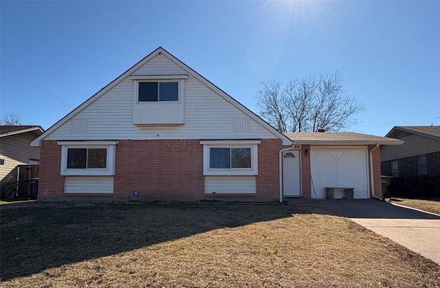 view of front of home featuring a garage and a front lawn