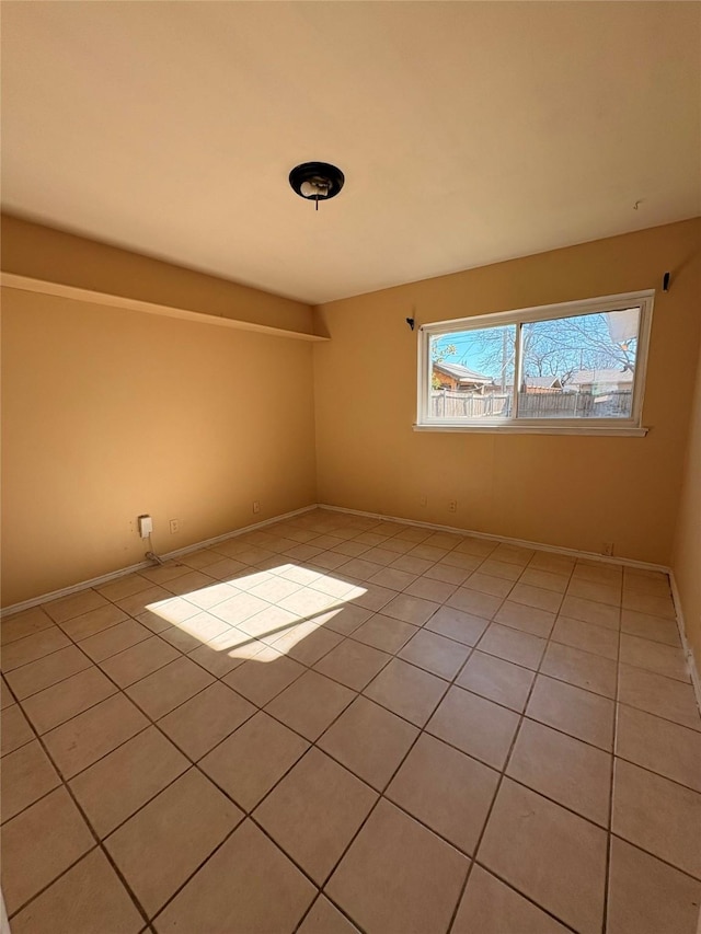 spare room with light tile patterned flooring