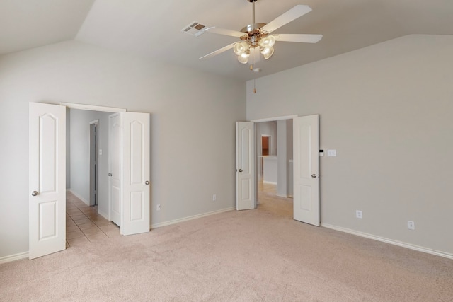 unfurnished bedroom with ceiling fan, light carpet, and lofted ceiling